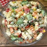 This Broccoli and Tomato Pasta Salad recipe is perfect for a summer picnic or backyard bbq side dish via flouronmyface.com