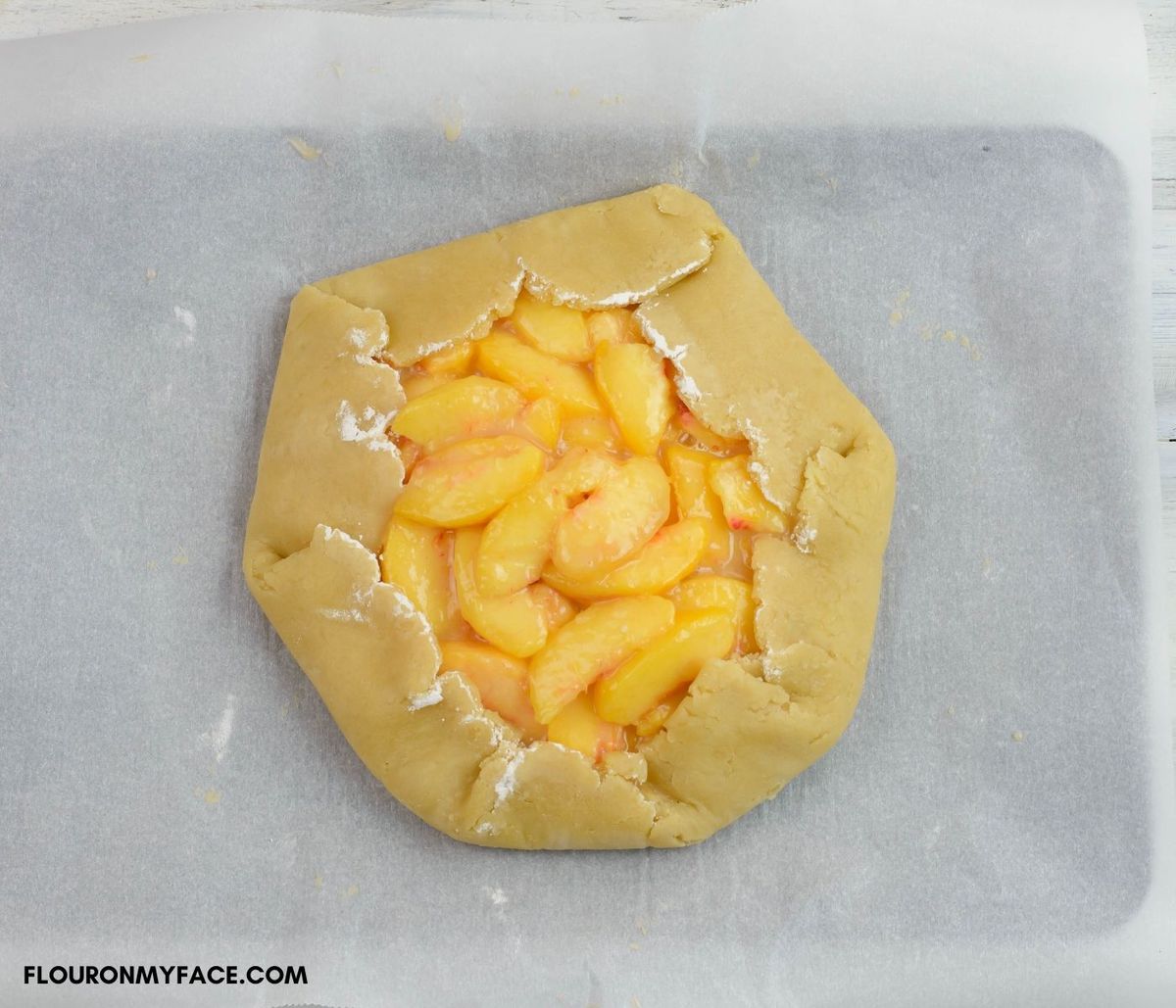 Example of how to fold the crust on a Rustic Peach Pie.