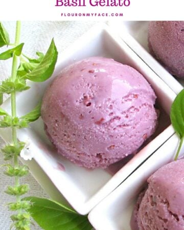Bright purple homemade blackberry and lemon basil gelato in a white serving dish.