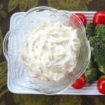 a bowl of ranch veggie dip served with fresh vegetables