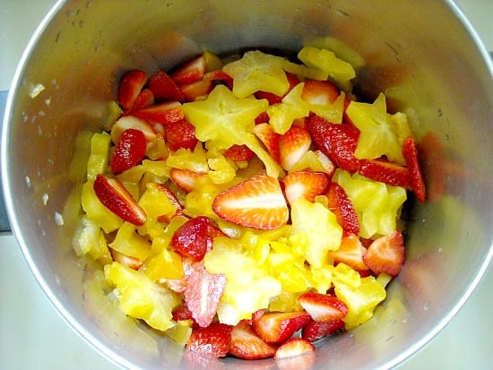 Carambola Strawberry Jam ingredients in a stainless steel bowl.