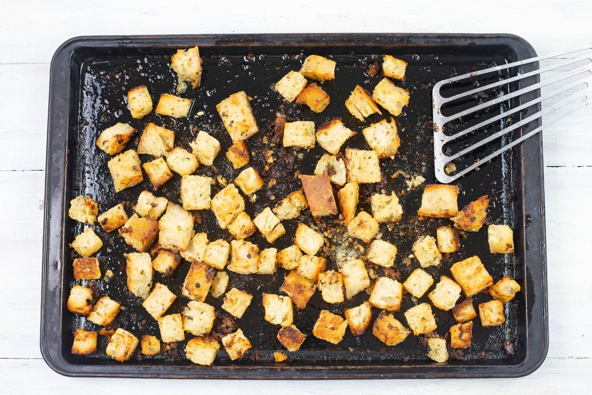 Baked croutons on pan.
