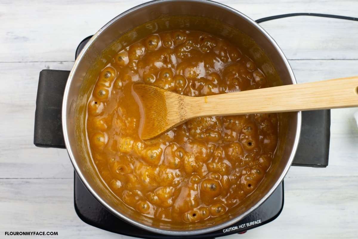 cooking fudge in a pot until the soft ball stage.