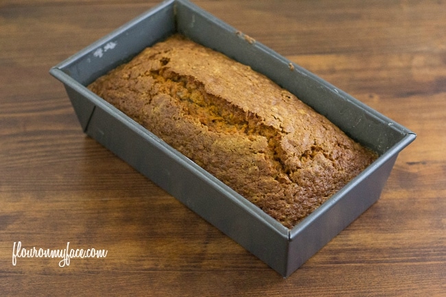 Loaf of Carrot Cake Bread still in the baking pan via flouronmyface.com