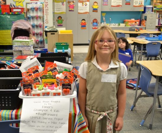 Hailey and our #Elmer's Glue Bag It Forward donation to her teacher.