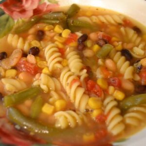 a bowl of crock pot vegetable and pasta soup