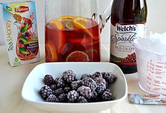 Frozen Blackberries, Sparkling Grape Juice and ice cubes for Sangria Mocktail