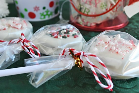 Christmas Oreo Cookie Pops wrapped in plastic for easy party favors or homemade holiday gifts.