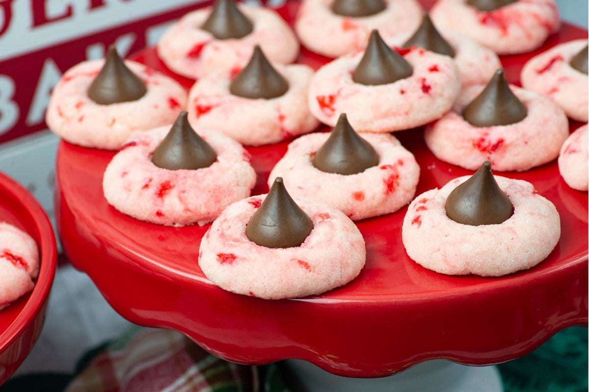 Closeup image of the cookies served on a red cake stand.