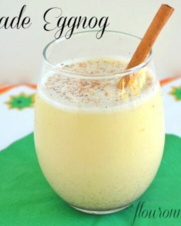 A glass of homemade eggnog on a holiday table.