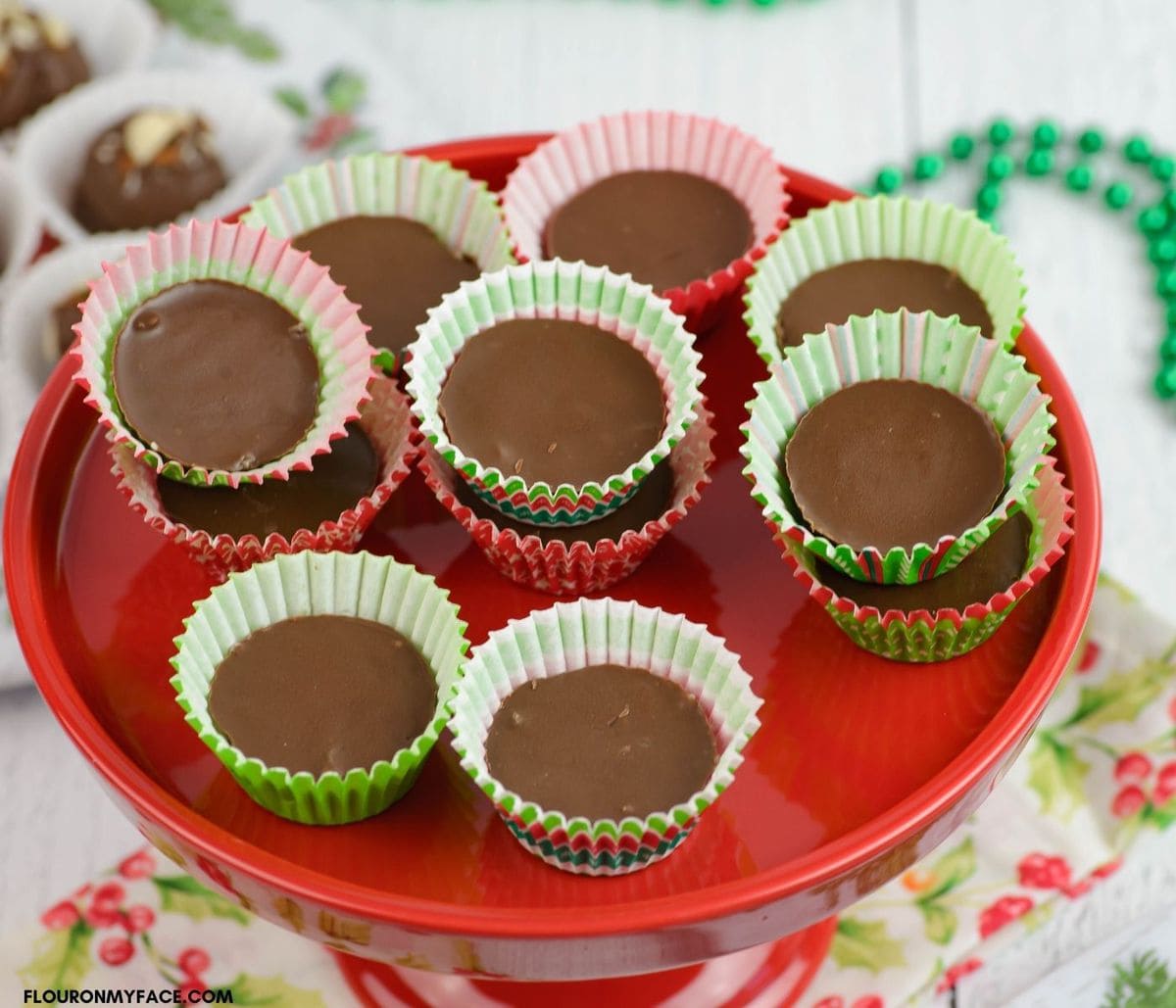 Copycat Mounds Candy Bites in color paper mini cups on a red cake stand.