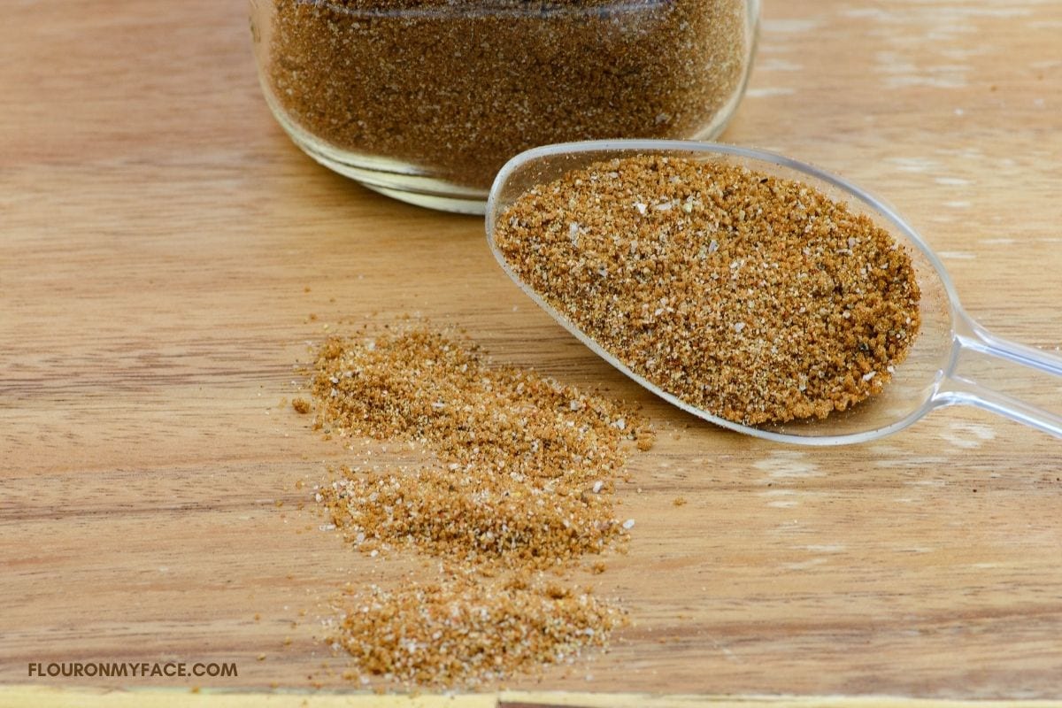 Dry pork rub on a wooden cutting board.