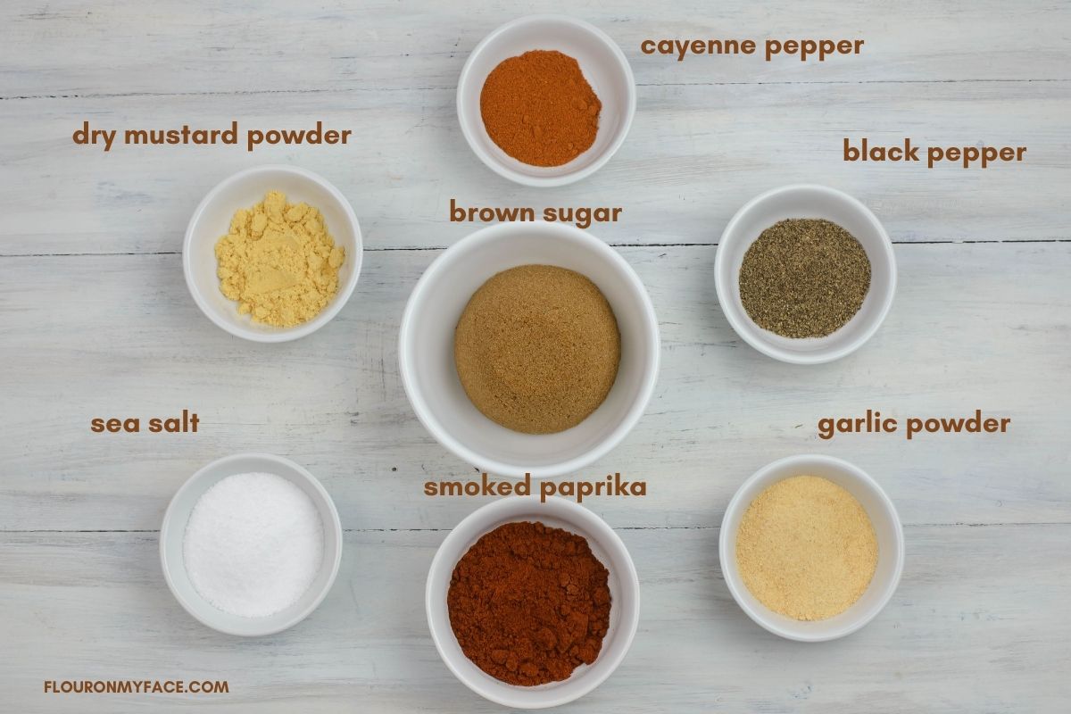 Sweet and spicy pork rub ingredients in individual bowls.