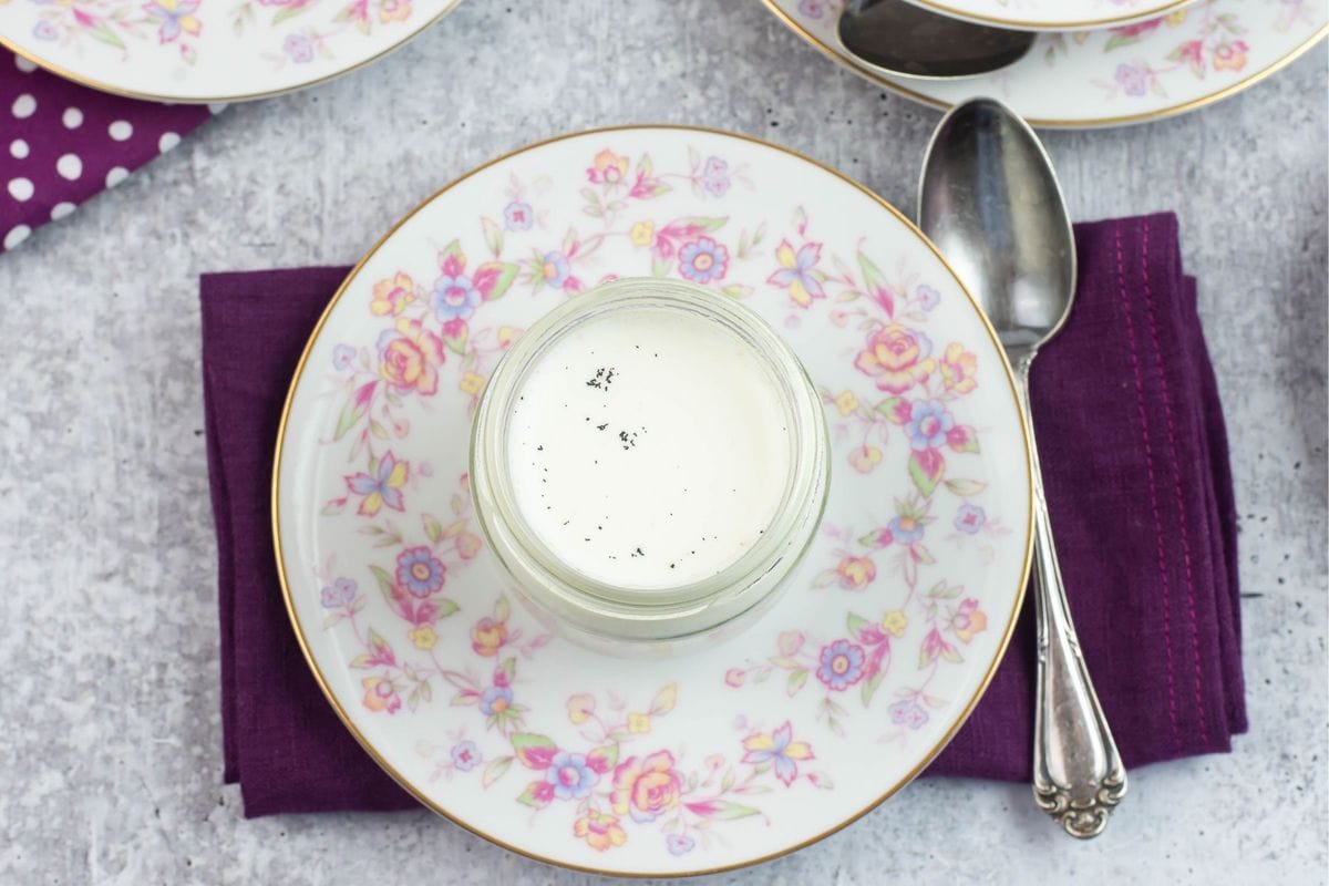 A serving on yogurt in a jar on a napkin.