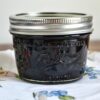 Blueberry Pepper Jam in a 4 oz canning jar.