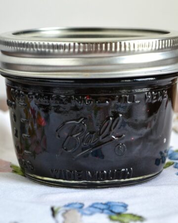 Blueberry Pepper Jam in a 4 oz canning jar.