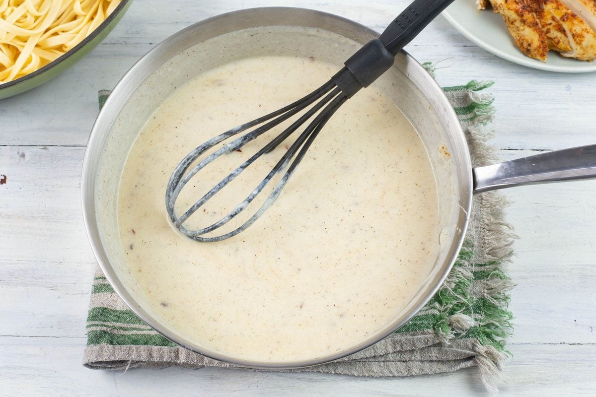Overhead image of the spicy alfredo sauce in a skillet.