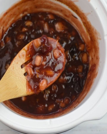 A wooden spoonful of cranberry compote.