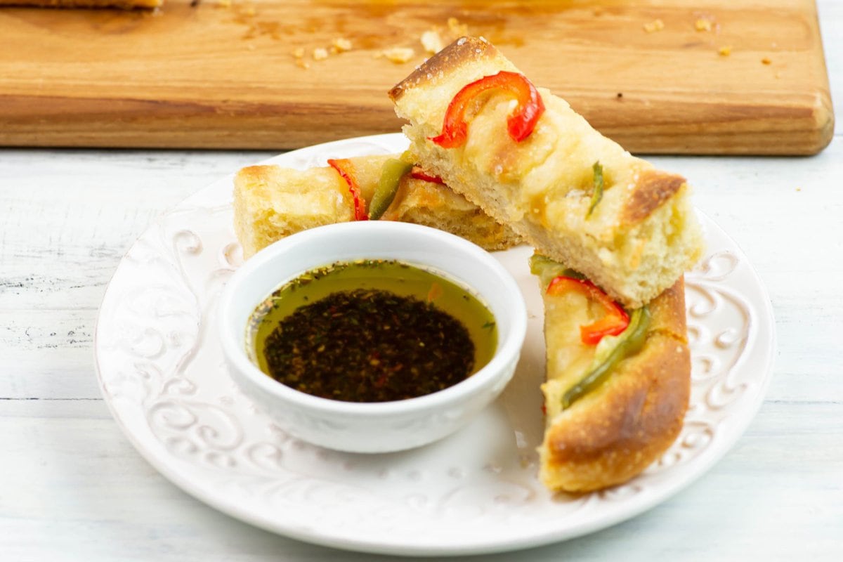 Sourdough Bread Sticks served with a small bowl of seasoned oil.