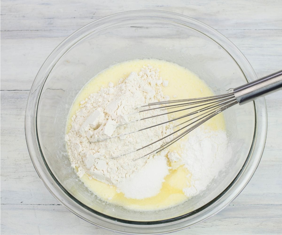 The dry ingredients are added to the bowl with the wet ingredients.