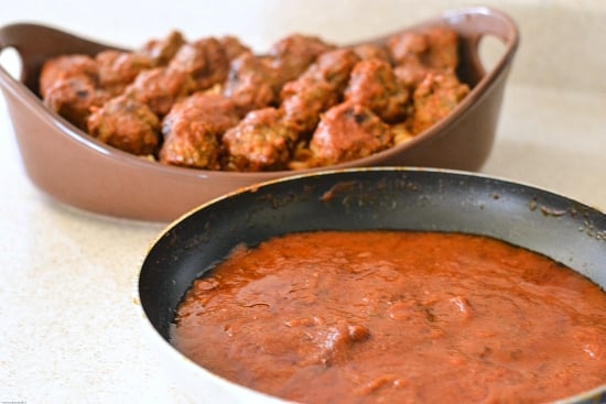 A skillet with simmering pasta sauce.