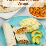 Crock Pot Buffalo Chicken Wraps on a plate served with avocado and potato salad.
