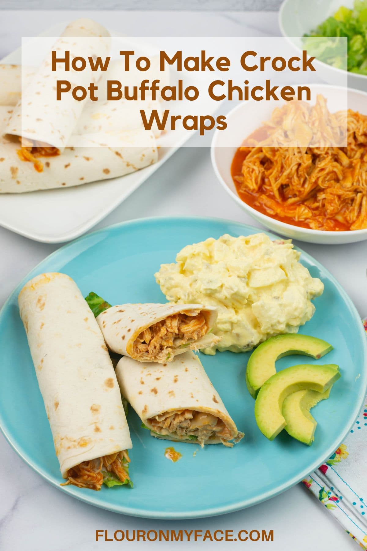 Crock Pot Buffalo Chicken Wraps on a plate served with avocado and potato salad.