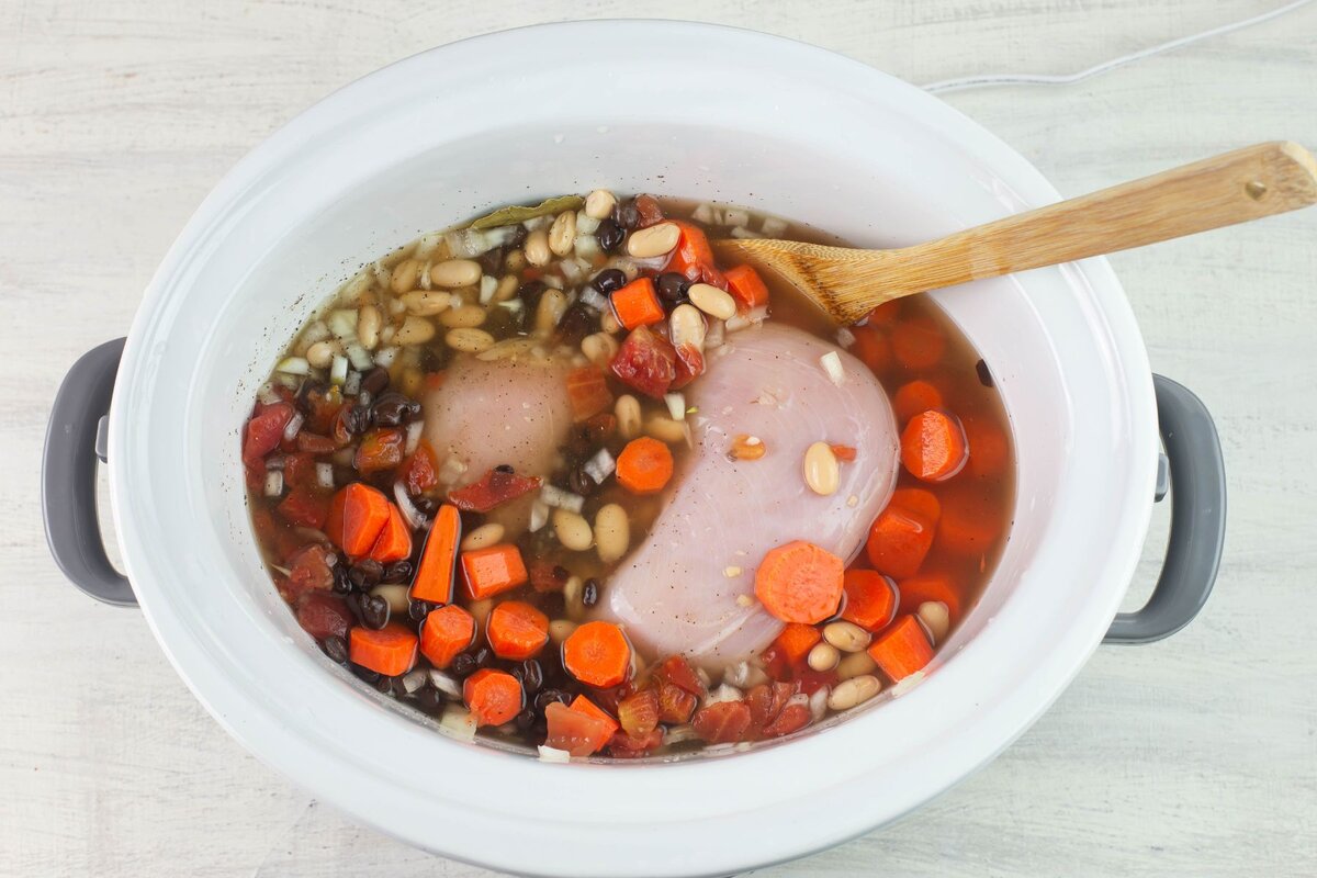 Covering ingredients with stock.