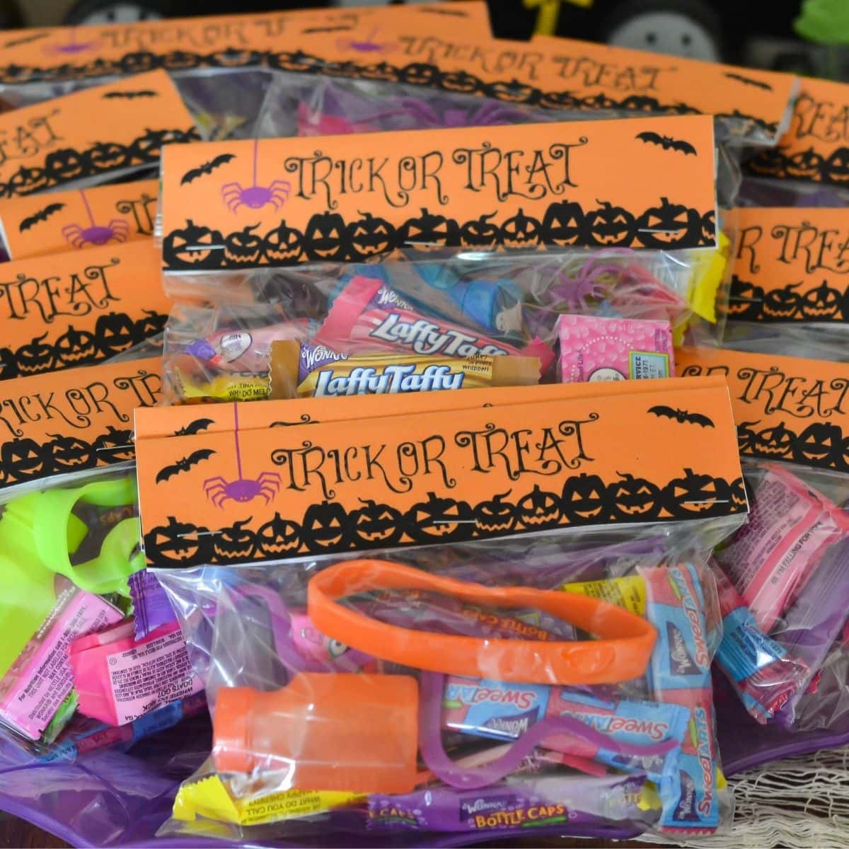 Halloween goodie bags decorated with a fun Halloween bag topper.