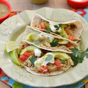 Chicken Salsa Verde served on flour tortillas with toppings.