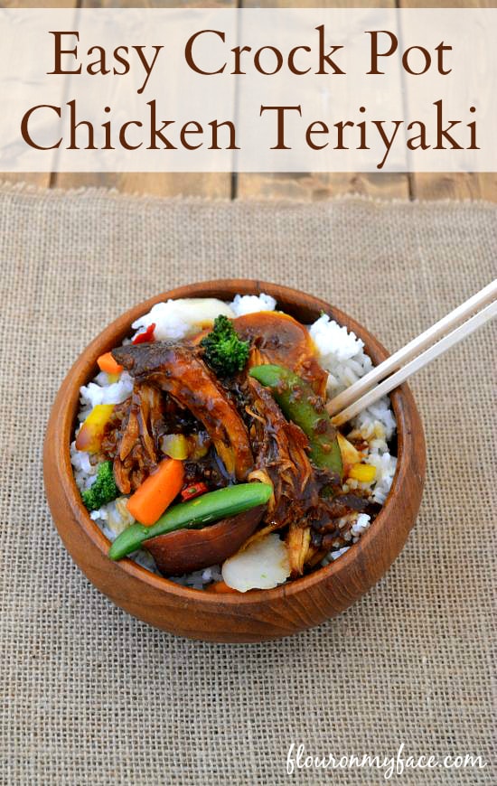 Crock Pot Chicken Teriyaki served over rice in a wooden bowl.