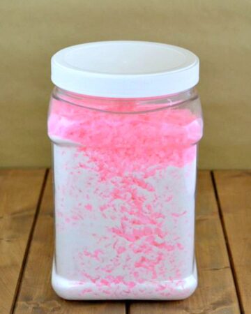 Plastic container filled with clump free homemade laundry detergent.