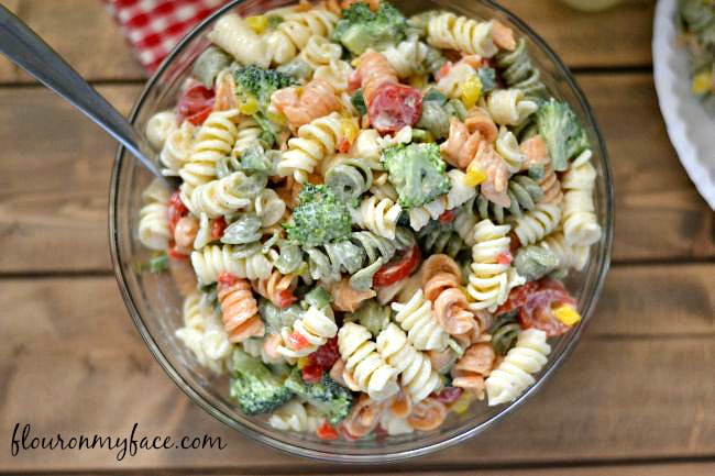 This Broccoli and Tomato Pasta Salad recipe is perfect for a summer picnic or backyard bbq side dish via flouronmyface.com