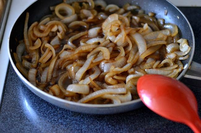 Cooking caramelized onions in a saute pan via flouronmyface.com #SplendaSweeties #SweetSwaps 