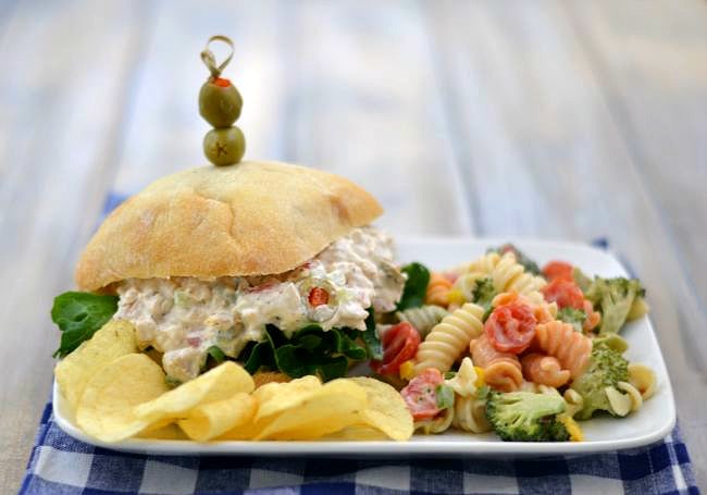 Rotisseria Chicken Salad recipe served on a ciabatta bun with a pasta salad via flouronmyface.com