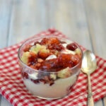 Crock Pot Cherry Cobbler served over a bowl of vanilla ice cream via flouronmyface.com