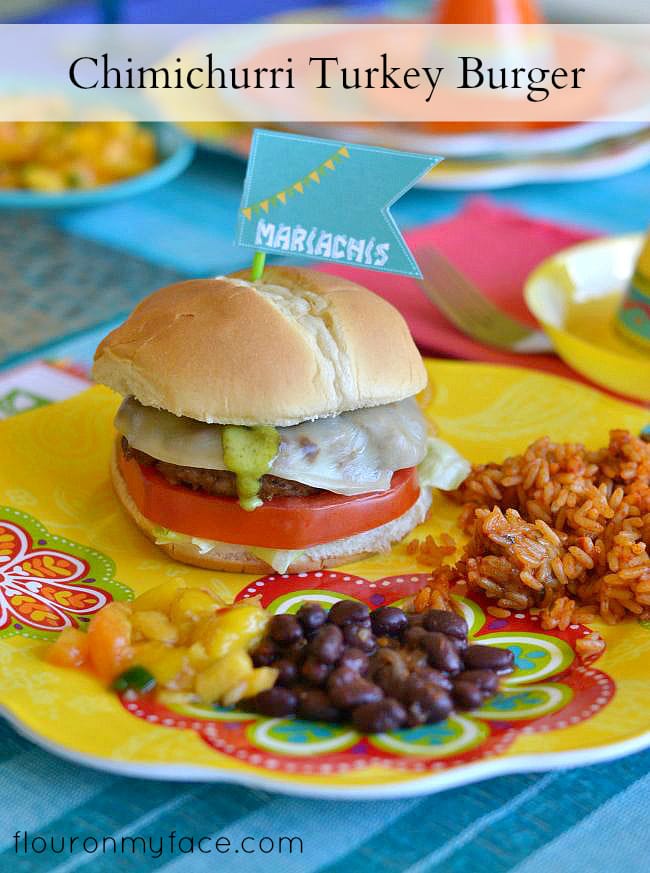 Chimichurri Turkey Burgers on a festive plate served with black beans