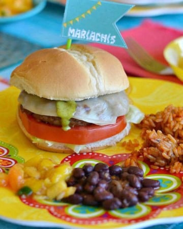 Chimichurri Burger on a plate with sides.