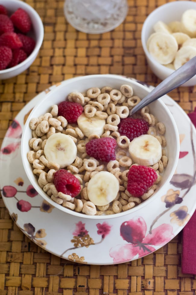 Cheerios with sliced banana and raspberries via flouronmyface.com #shop