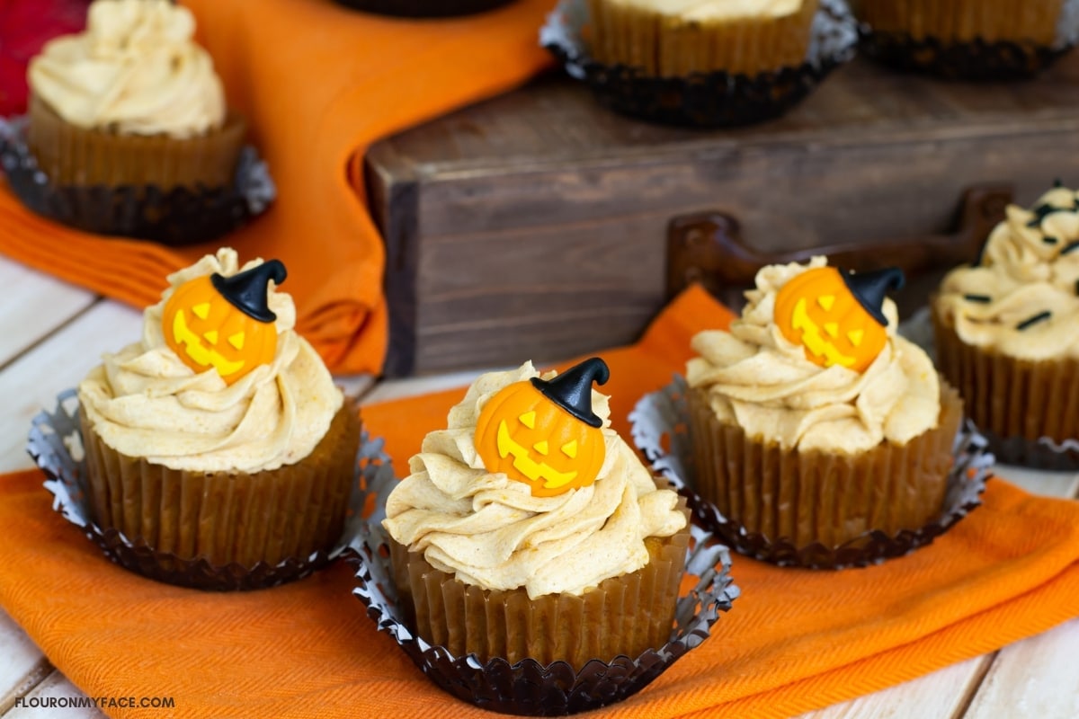 Halloween decorated pumpkin cupcakes with Pumpkin Spice Buttercream Frosting