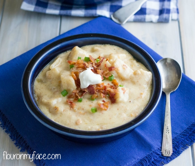 A thick and creamy bowl of Crock Pot Loaded Potato Soup is juts what you need for dinner on a chilly Fall evening via flouronmyface.com #CrockPotFriday