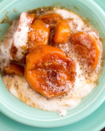 Candied Sweet Potatoes in a teal Fiesta-ware bowl