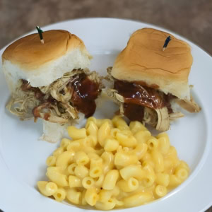 2 Hatch Chile Chicken Sliders on plate with mac & cheese