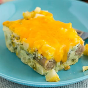 Square serving of Sausage Egg and Cheese breakfast casserole on a plate.