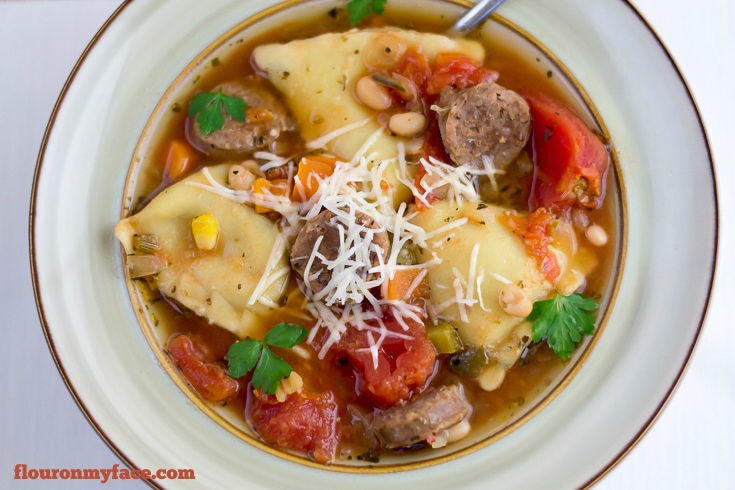 Nice and Spicy Crock Pot Italian Sausage Ravioli Soup recipe via flouronmyface.com