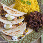 Easy Crock Pot Salsa Chicken served on tortillas on a plate