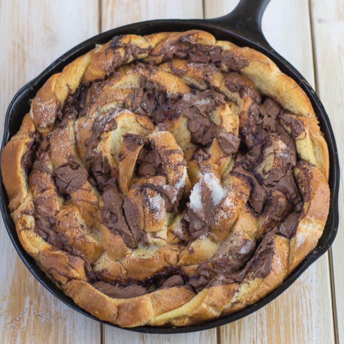 Nutella French Toast Casserole in a cast iron skillet.