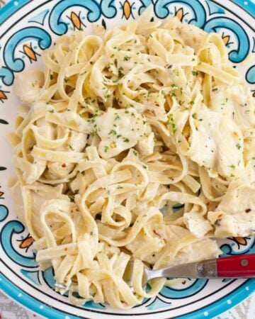 A serving of Spicy Chicken Alfredo on a dinner plate.