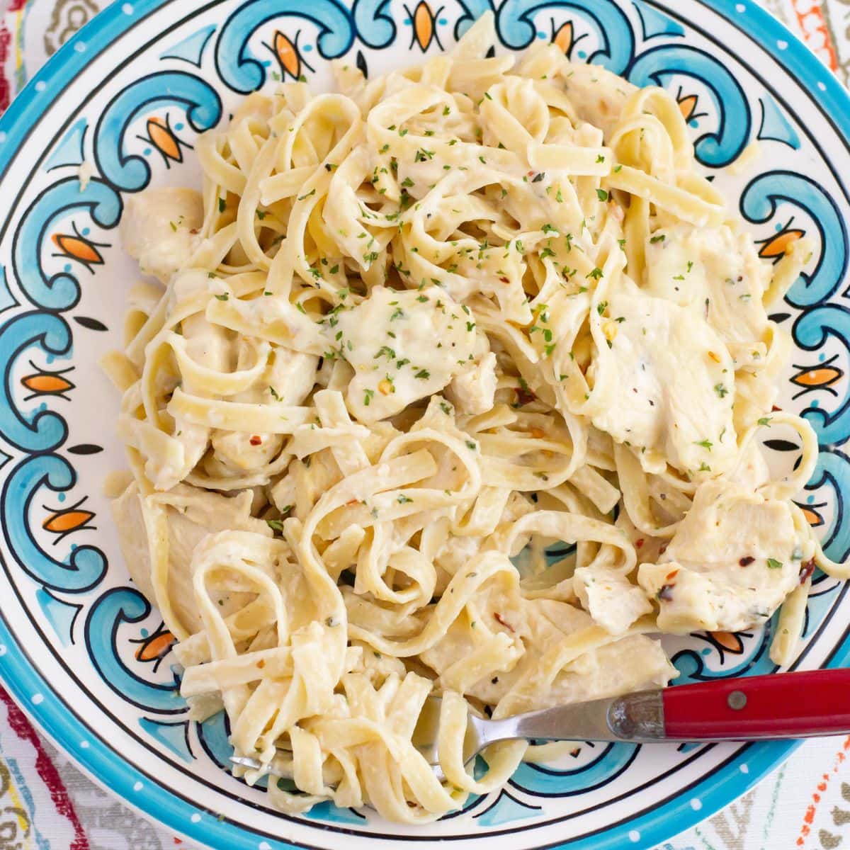 A serving of Spicy Chicken Alfredo on a dinner plate.