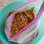 an overhead view of an open gallon ziploack bag filled with sloppy joe mix